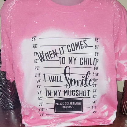 WHEN IT COMES TO MY CHILD I WILL SMILE IN MY MUGSHOT | Graphic Tees Collection | Pink Innovations LLC